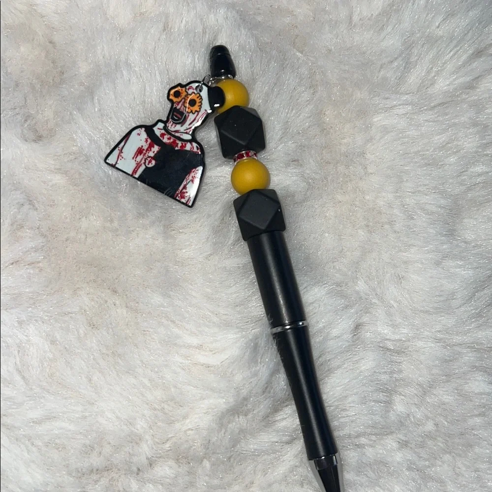 Black and Yellow Beaded Pen with Art the clown Charm